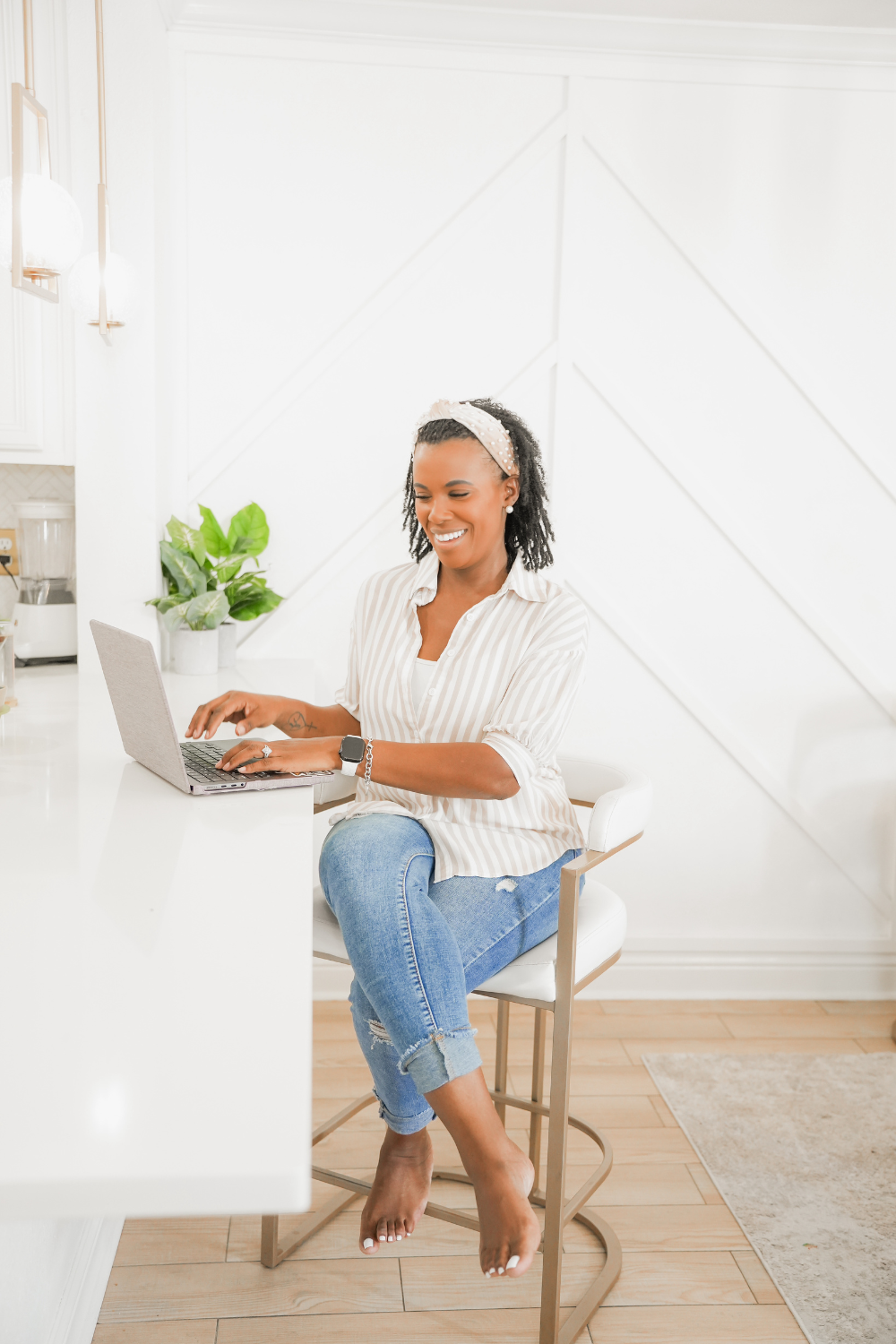 Dr. Gervase Ware working on a $29 digital product on her laptop