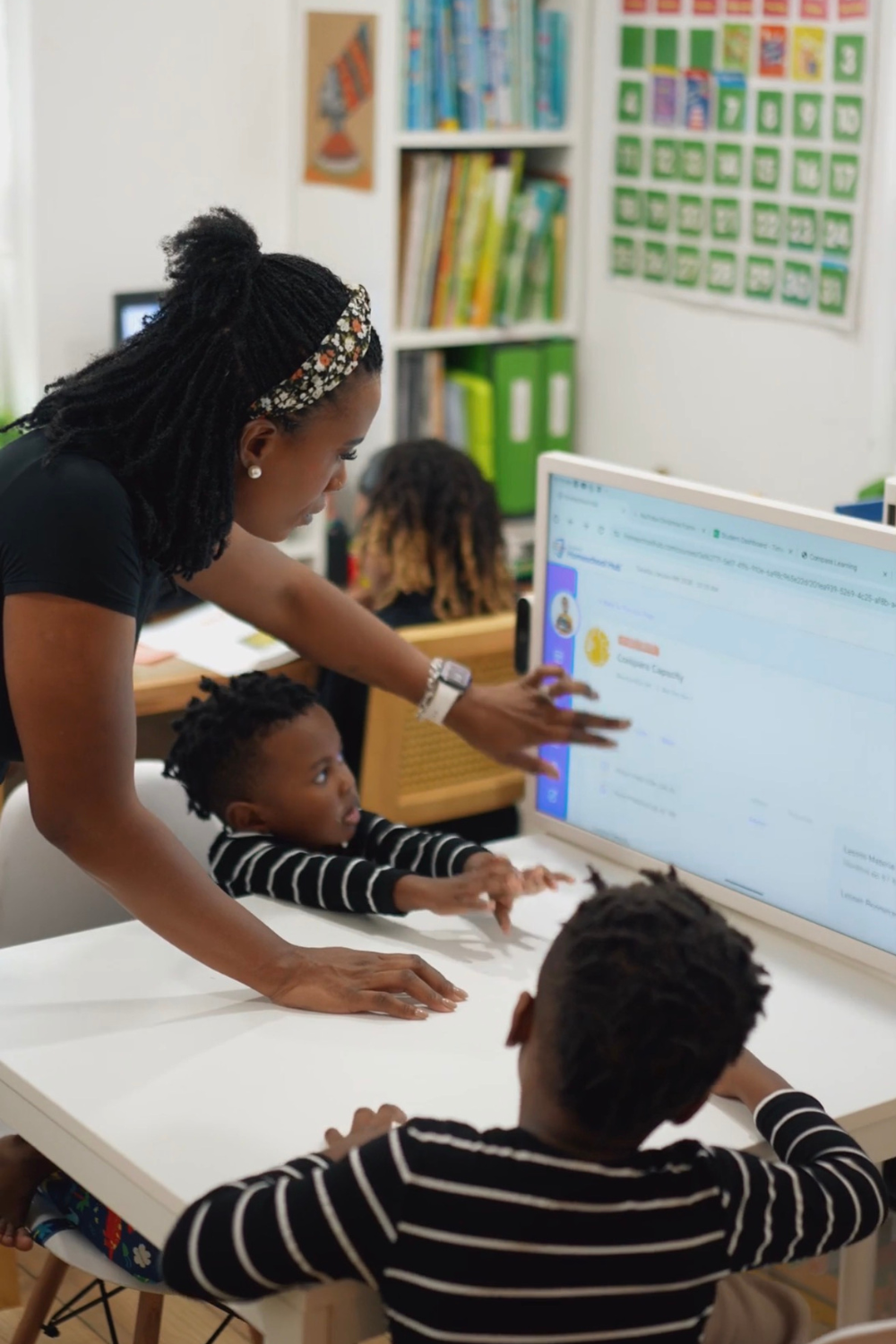 Gervase Ware teaching her children in a homeschool setting