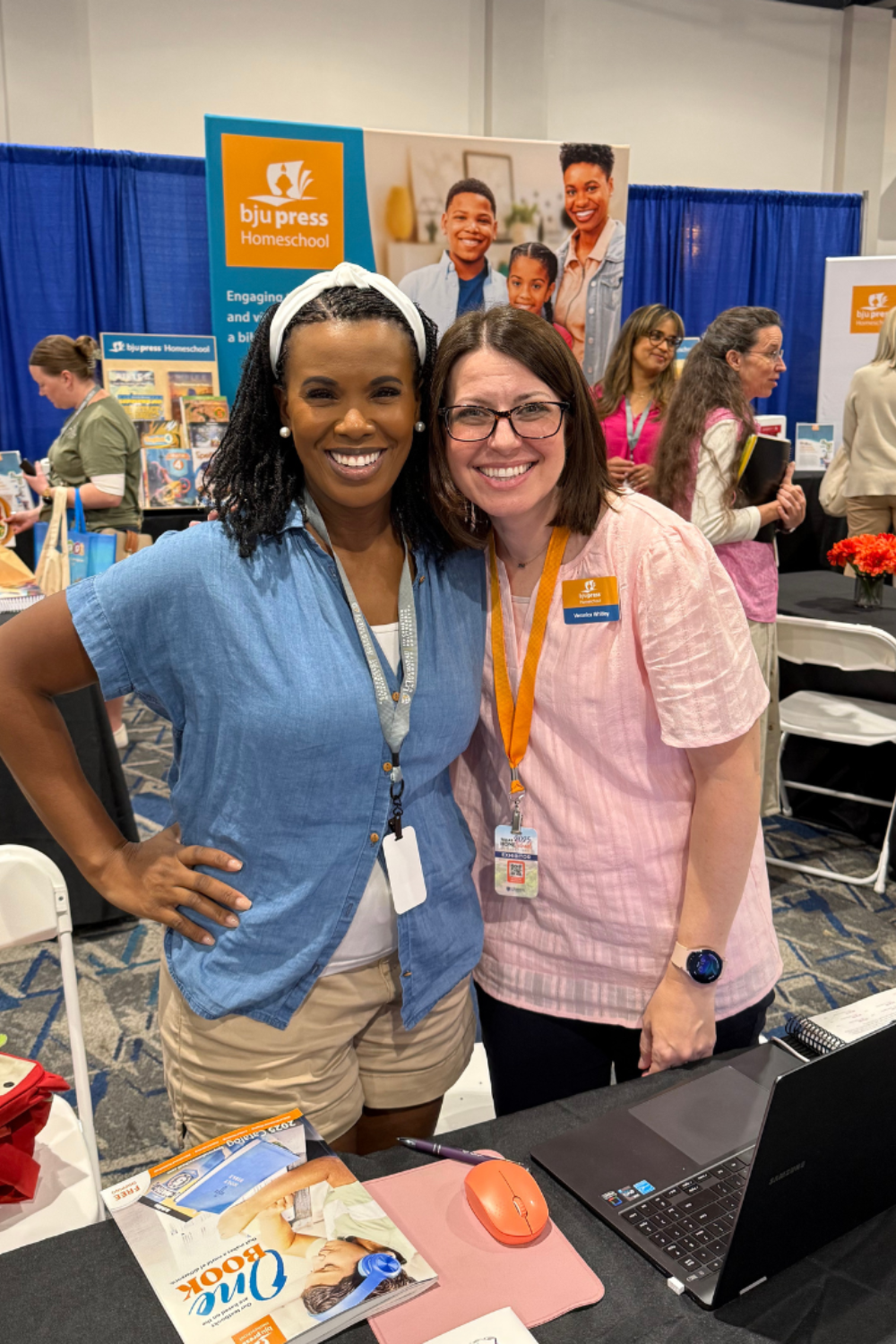 Gervase Ware with another homeschool Mom at a homeschool convention.